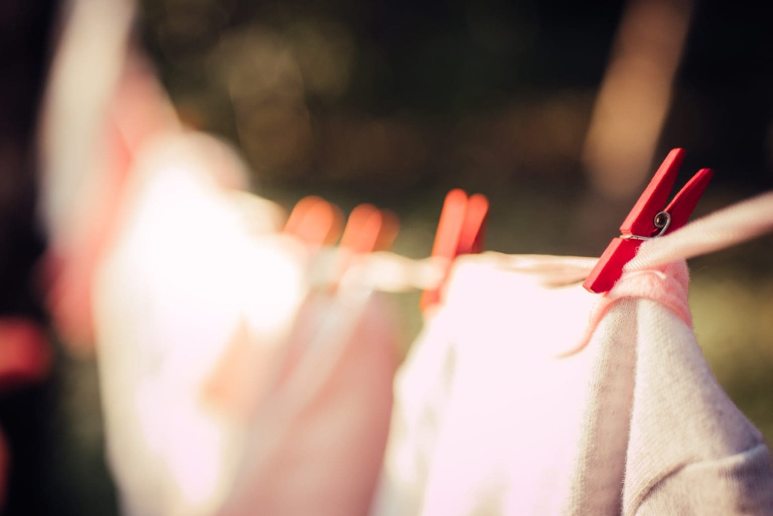 several items of clothing hanging outside on washing line