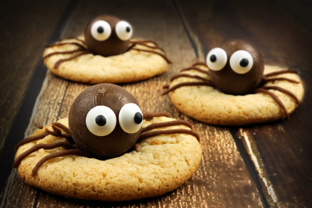 chocolate spiders on top of biscuits