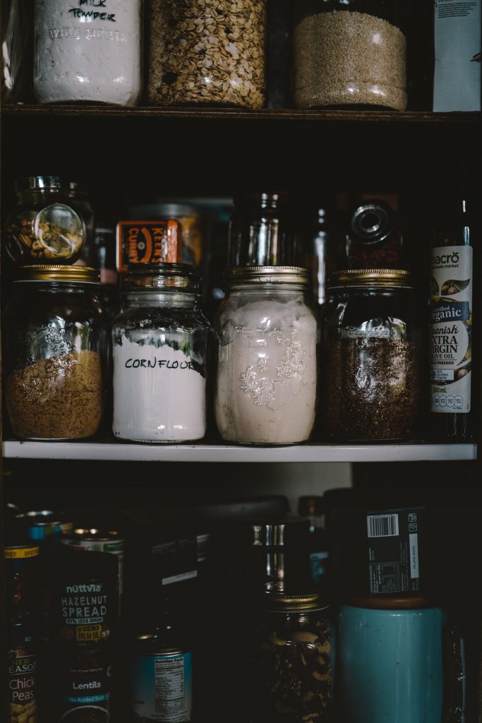 reused mason jars in a pantry to save energy at home