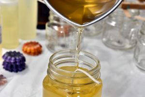 final step for your DIY soy wax candle: pouring the melted wax into your container