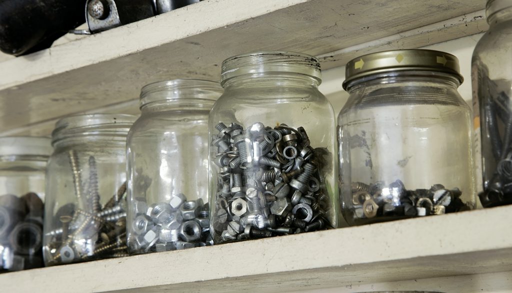 A selection of jars being used to store nuts, bolts and screws