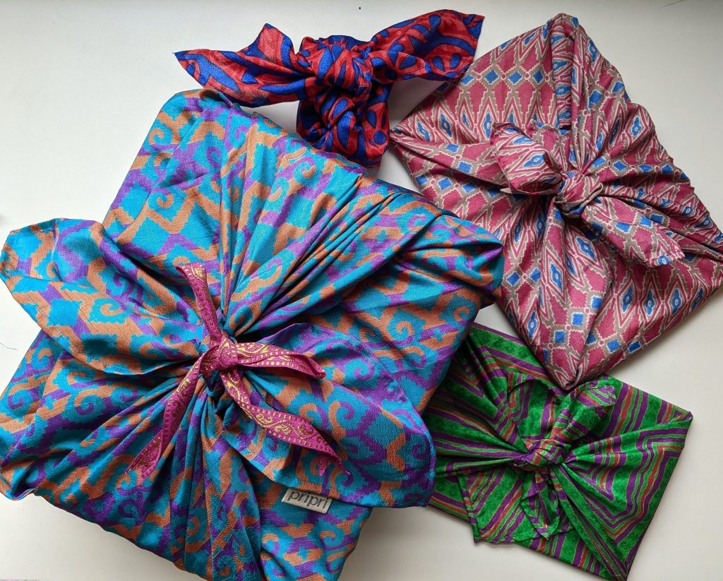 Gifts wrapped in Furoshiki gift wraps made from upcycled saris by Pri Pri